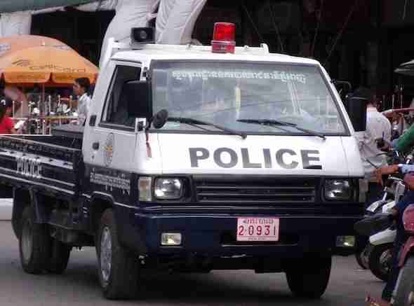 Police pick up truck in Cambodia